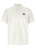 Chemise polo blanche en coton de la marque Kenzo, vue de face, avec col et boutons visibles.