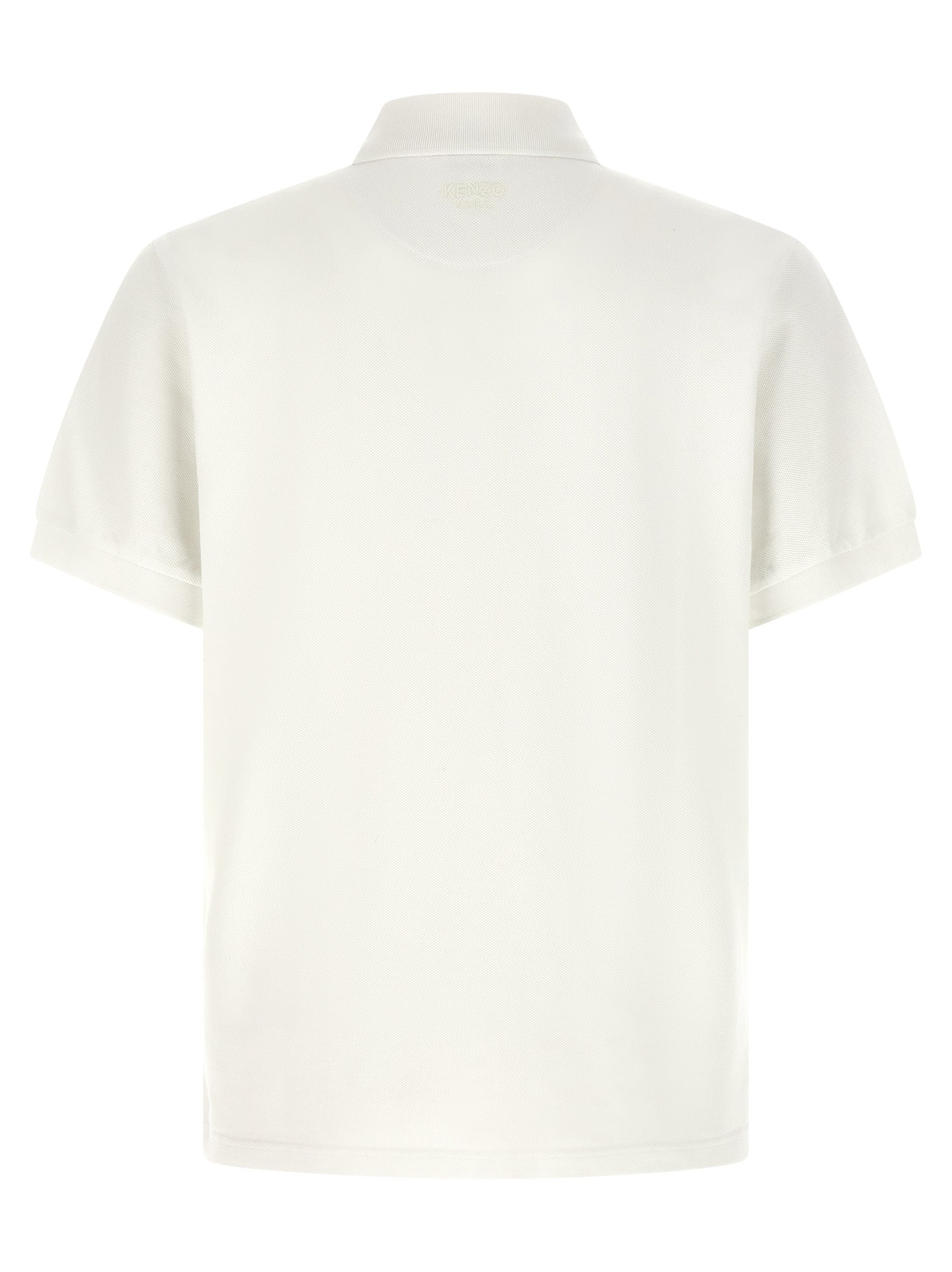 Chemise polo blanche en coton de la marque Kenzo, vue de face avec col et boutons visibles.