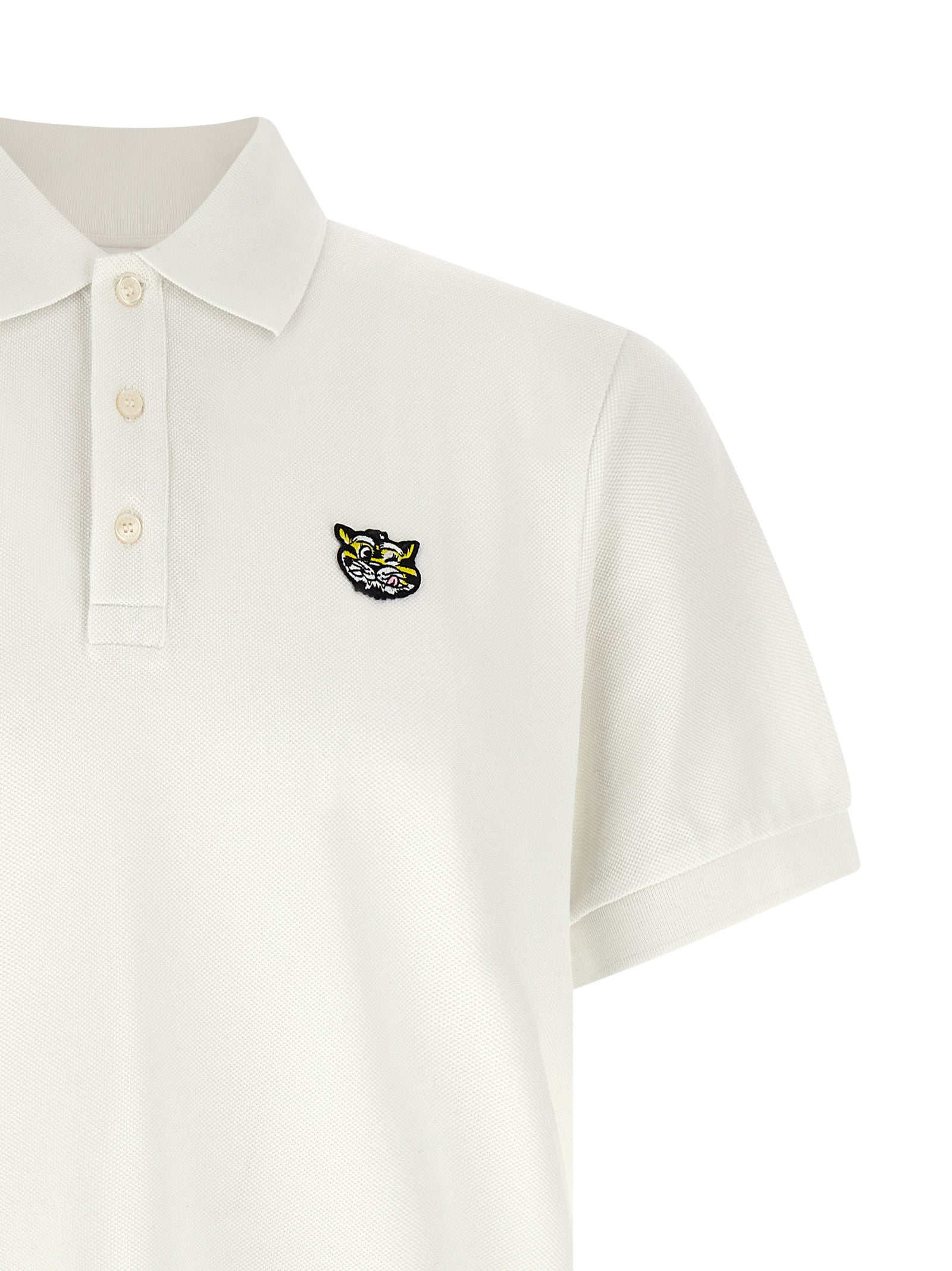 Chemise polo blanche en coton de la marque Kenzo, avec col classique et logo discreet visible.