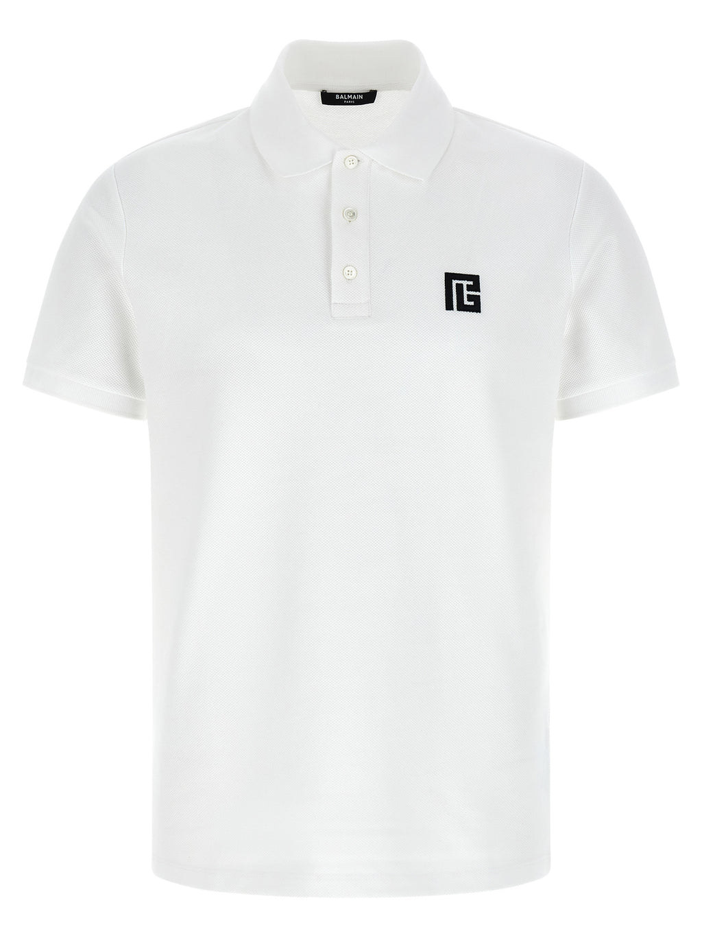 Chemise polo en coton bicolore Balmain, vue de face, avec col et logo Balmain visible, style élégant et moderne.
