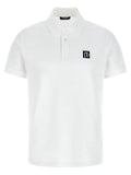 Chemise polo en coton bicolore Balmain, vue de face, avec col et logo Balmain visible, style élégant et moderne.