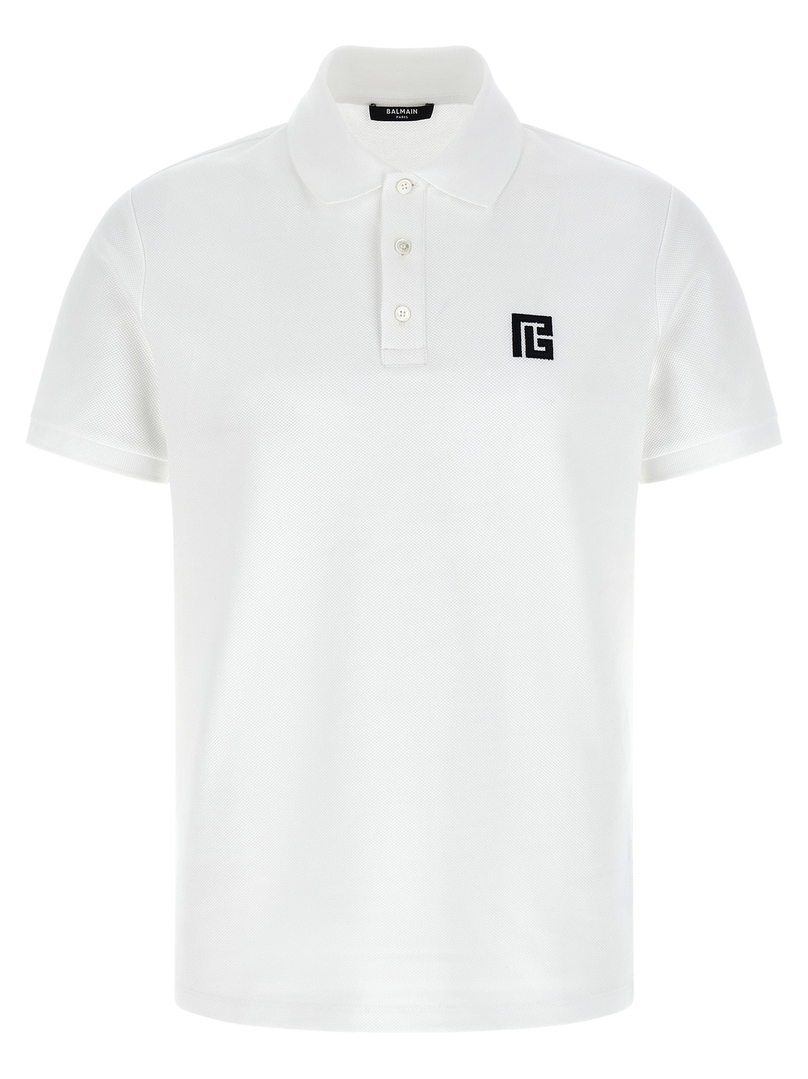 Chemise polo en coton bicolore Balmain, vue de face, avec col et logo Balmain visible, style élégant et moderne.