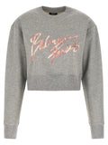 Sweatshirt gris en coton de Balmain, vêtement décontracté avec logo, porté sur un mannequin.