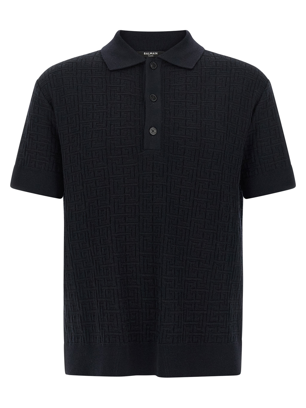 Chemise polo en laine bleue Balmain, vue détaillée du tissu et du col, style élégant et sophistiqué.