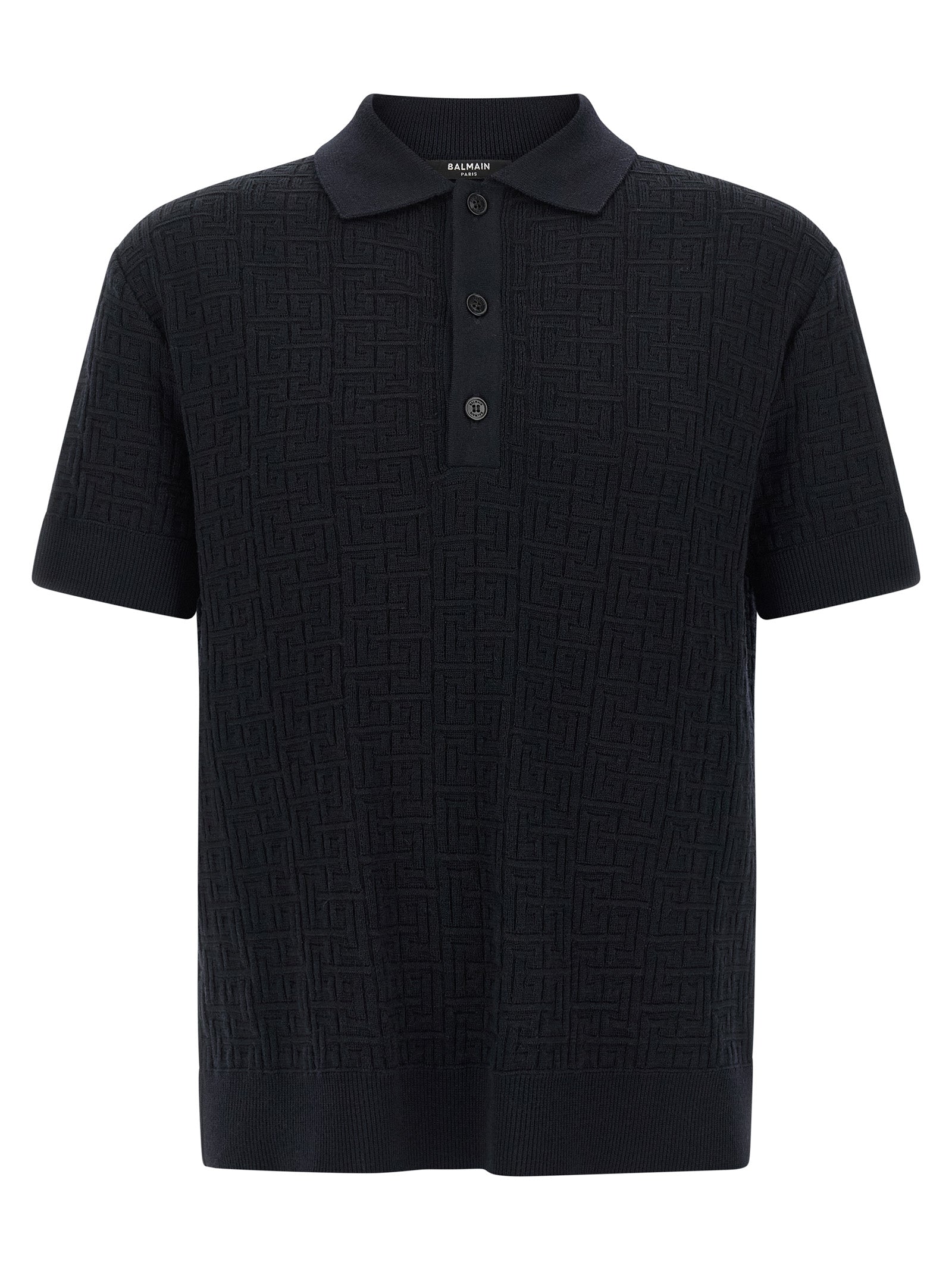 Chemise polo en laine bleue Balmain, vue détaillée du tissu et du col, style élégant et sophistiqué.