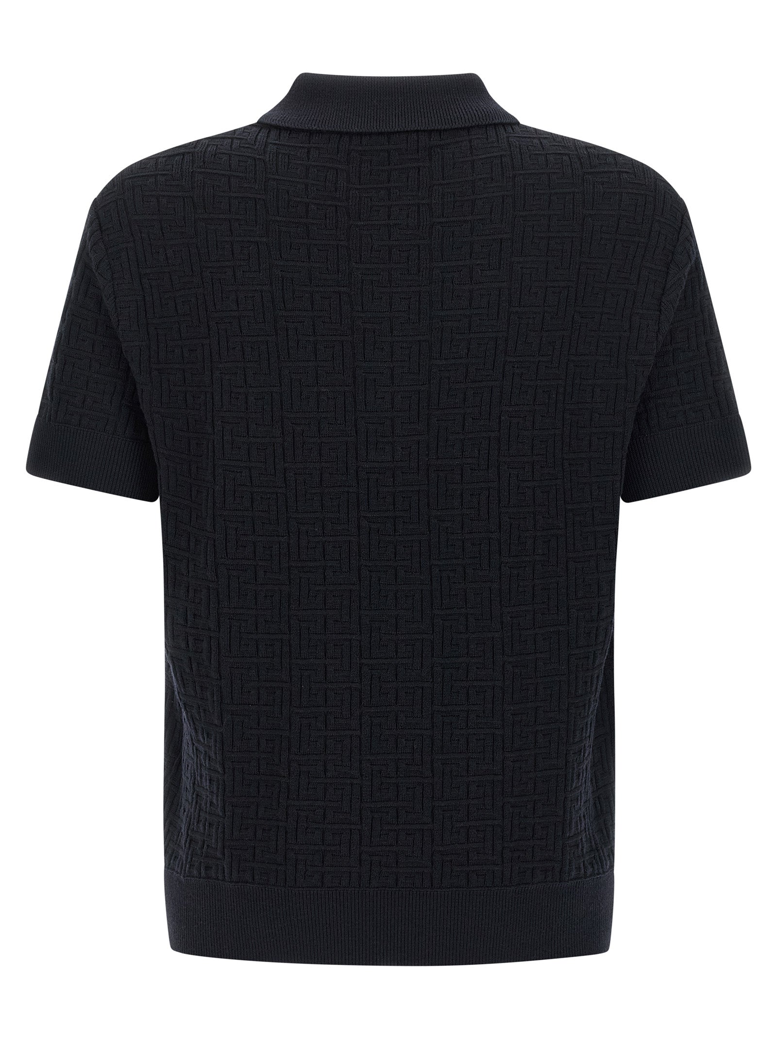 Chemise polo en laine bleue Balmain, vue de face, avec col classique et logo brodé sur la poitrine.