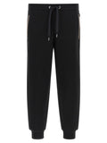 Pantalons de jogging en coton noir de Hugo Boss, style décontracté, avec ceinture élastique et poches latérales.
