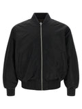 Veste bomber en polyamide noire de Diesel, style moderne avec logo Diesel visible sur la poitrine.