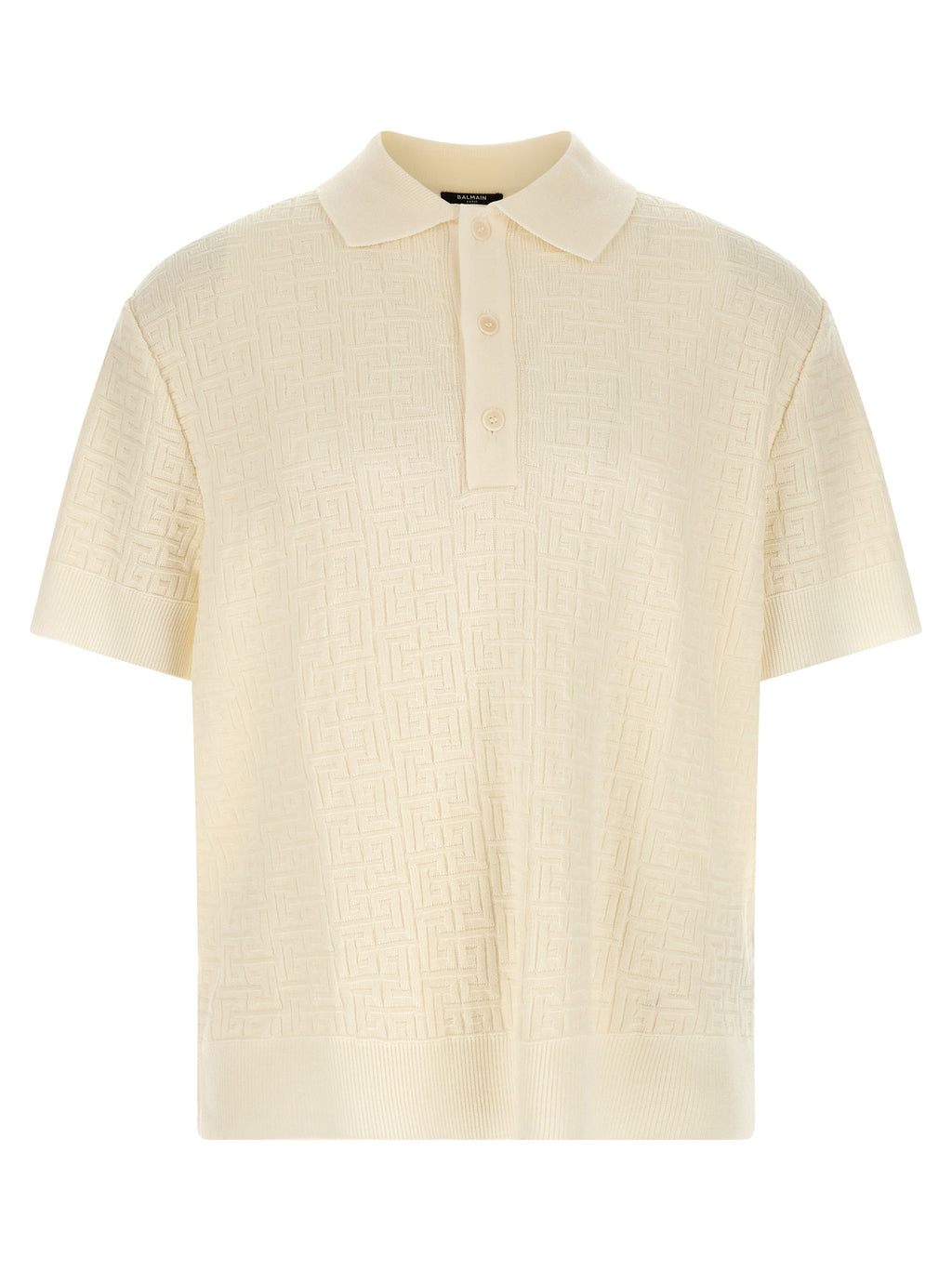 Chemise polo en laine blanche Balmain, vue détaillée du devant avec col et boutons, tissu doux et élégant.