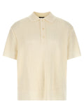 Chemise polo en laine blanche Balmain, vue détaillée du devant avec col et boutons, tissu doux et élégant.