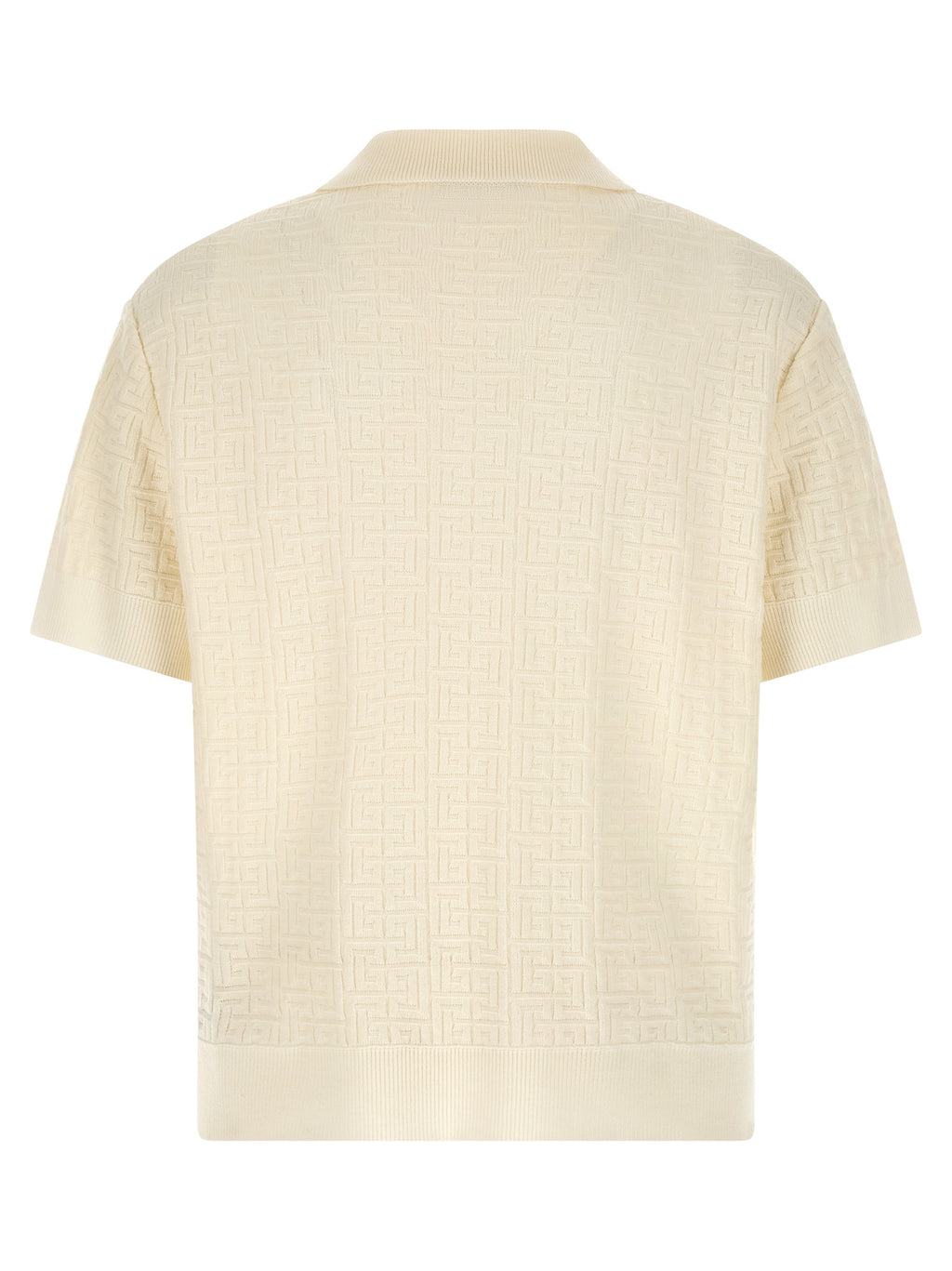 Chemise polo en laine blanche Balmain, vue de face, détails du col et du logo sur la poitrine.