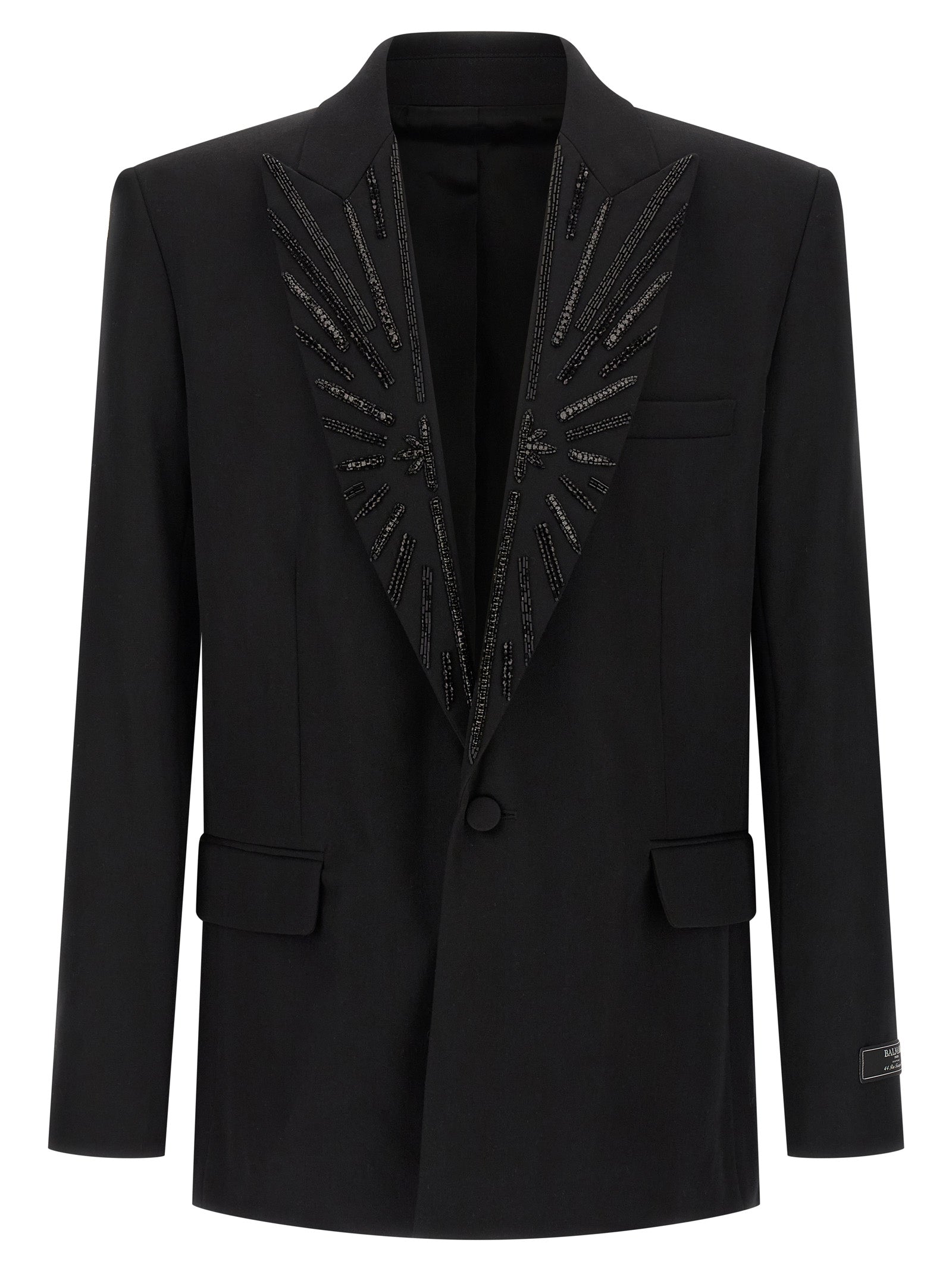 Veste blazer noire en laine vierge Balmain, ajustée et élégante, avec détails sophistiqués et coupe structurée.