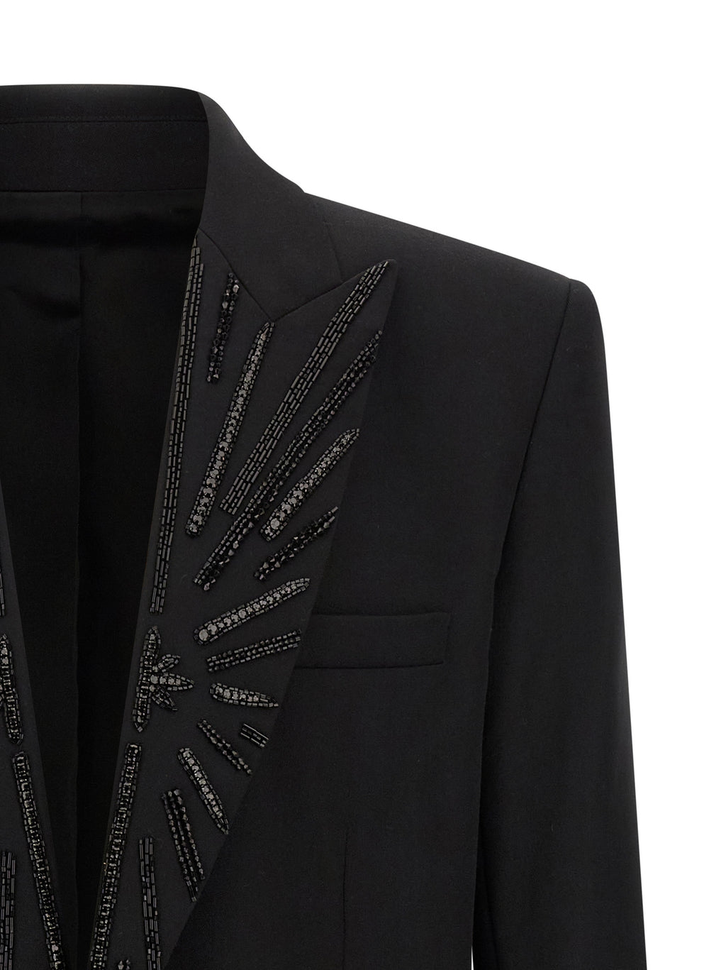Blazer noir en laine vierge de Balmain, coupe élégante, avec revers classiques et détails modernes pour un style sophistiqué.