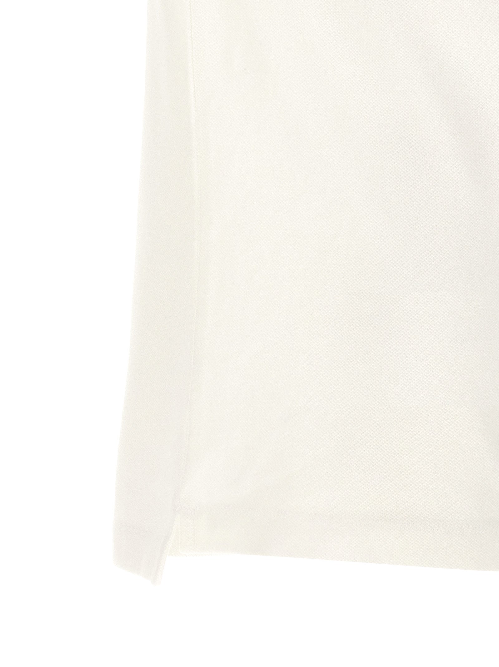 Chemise polo en coton blanc de Dsquared², avec col classique et logo discret, vue de face.