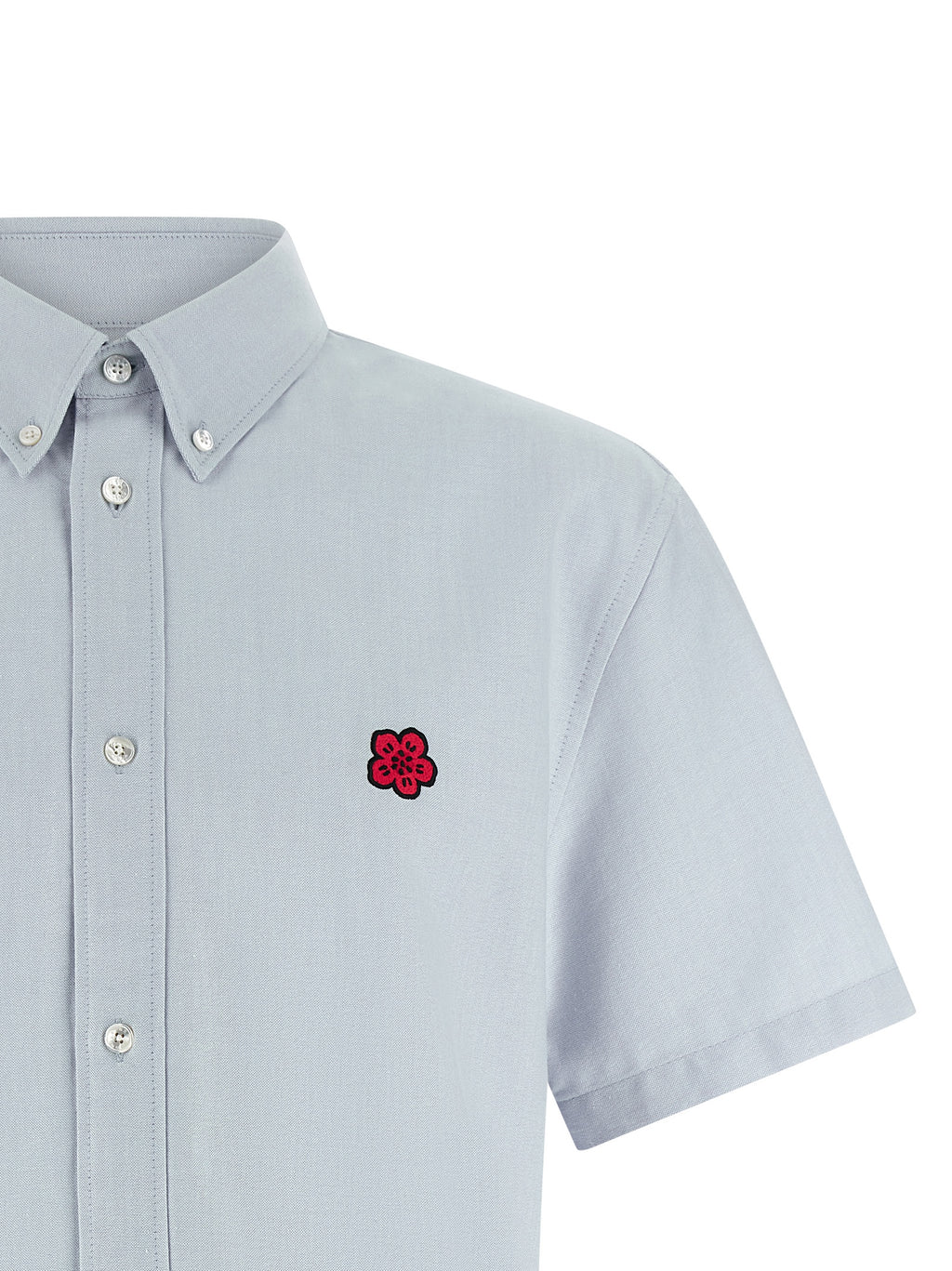 Chemise en coton bleu de la marque Kenzo, détails visibles, style élégant et décontracté.