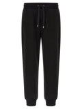 Pantalons de jogging en coton noir Dolce & Gabbana pour l'entraînement, avec détails de style décontracté et logo discret.