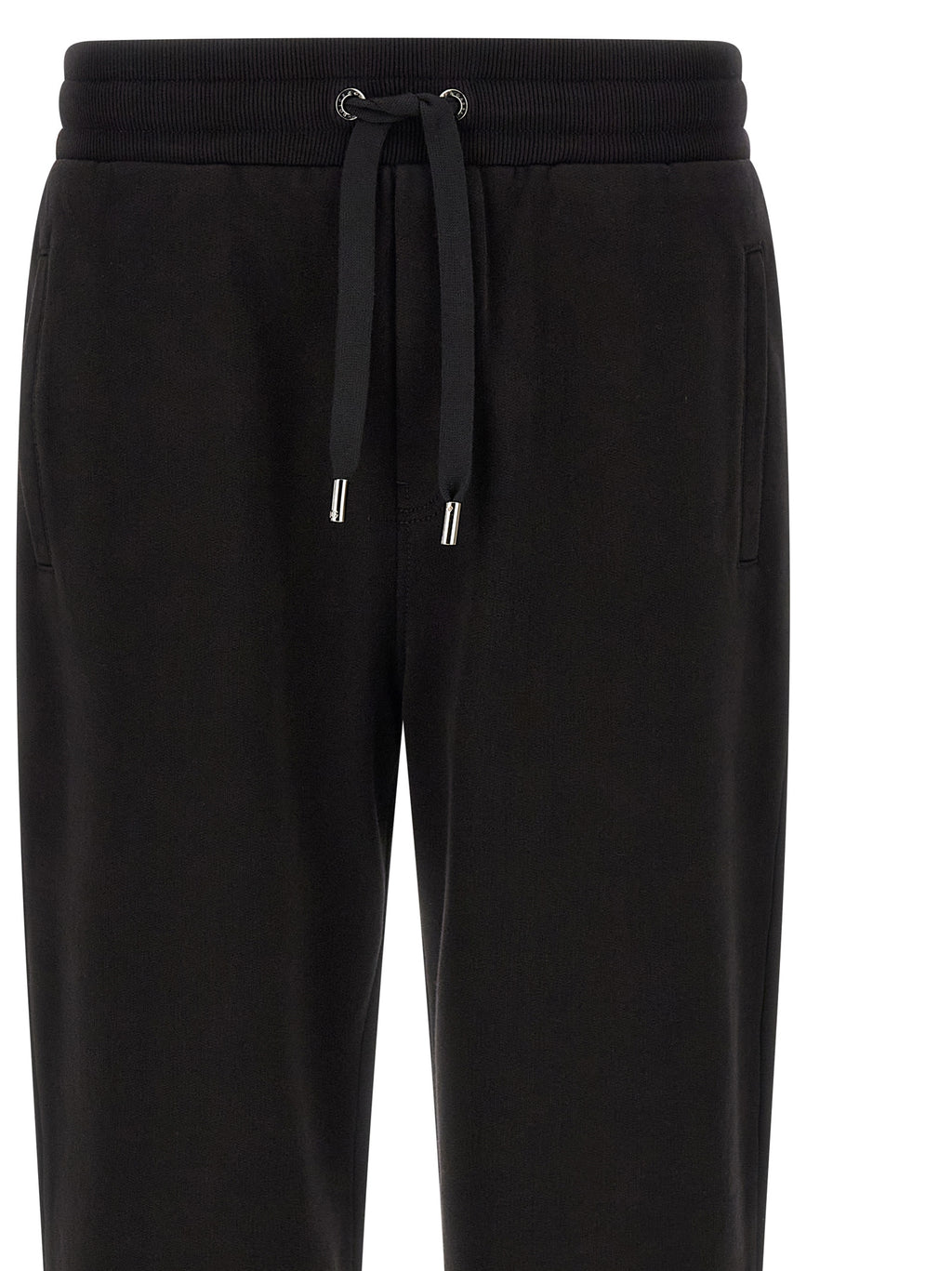 Pantalons de sport en coton noir Dolce & Gabbana, joggers de workout avec logo sur la jambe, style décontracté et confortable.