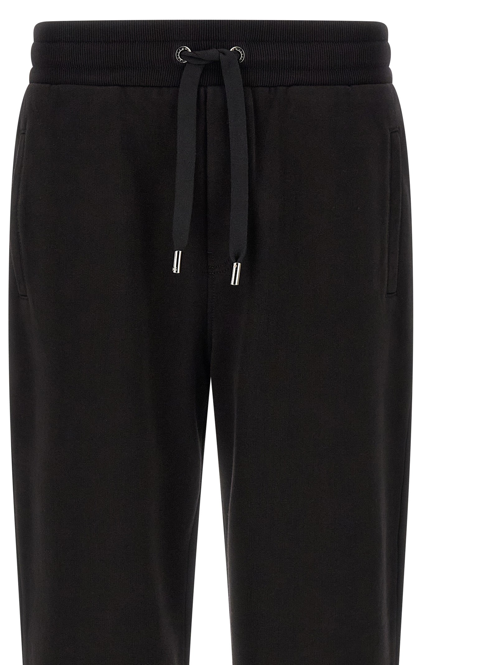 Pantalons de sport en coton noir Dolce & Gabbana, joggers de workout avec logo sur la jambe, style décontracté et confortable.