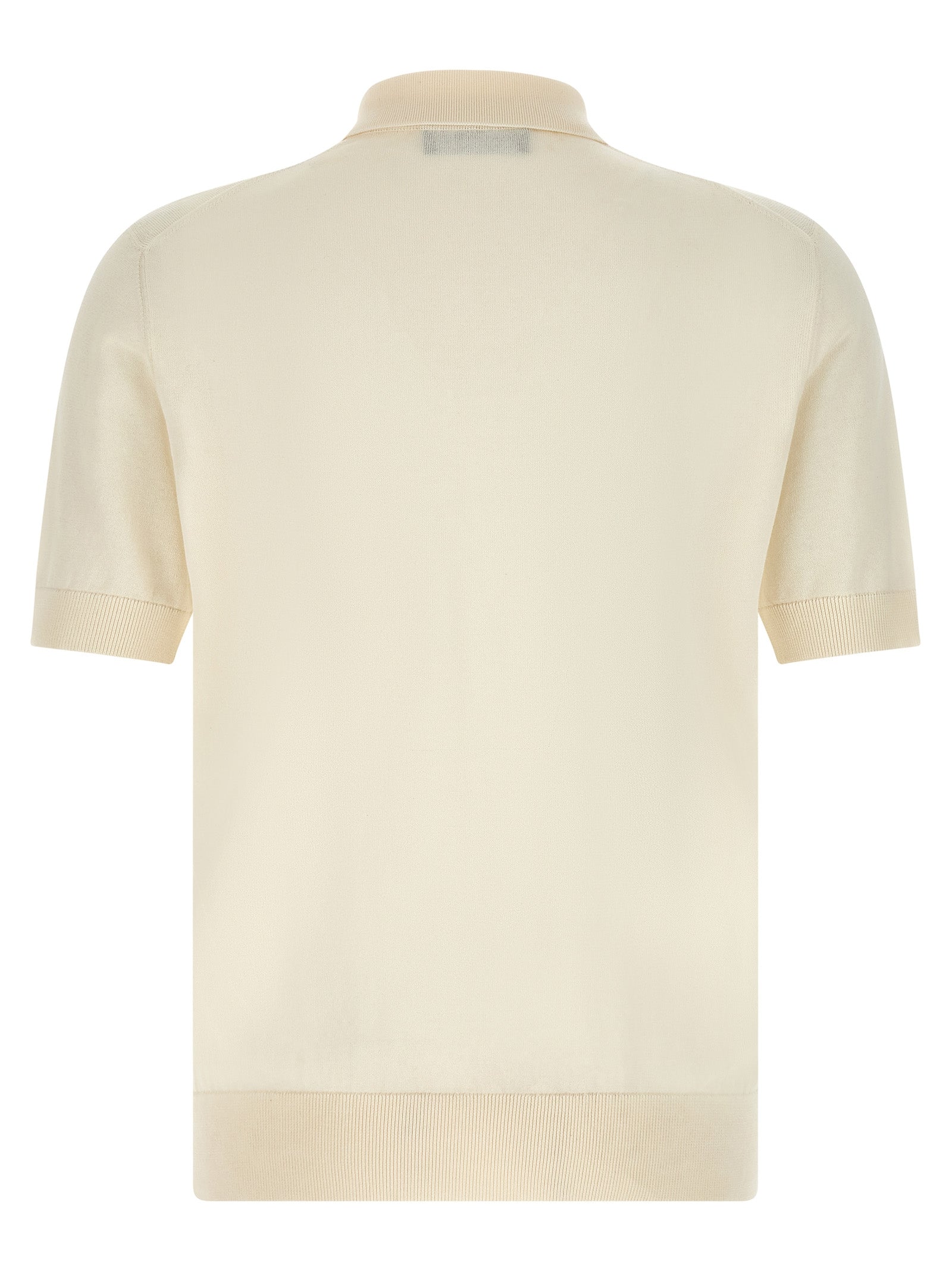 Chemise polo blanche en coton de Dolce & Gabbana, détail du tissu et col classique visible sur l'image.