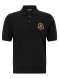 Chemise polo en laine vierge noire Dolce & Gabbana, détail du col et du logo, vue de face.