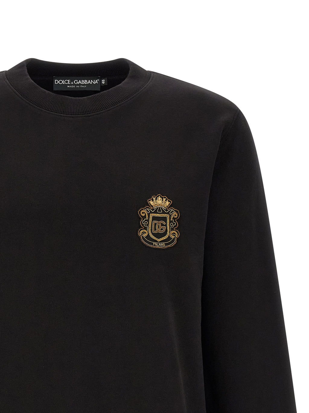 Sweat-shirt noir en coton de Dolce & Gabbana, design élégant avec logo visible, porté décontracté.