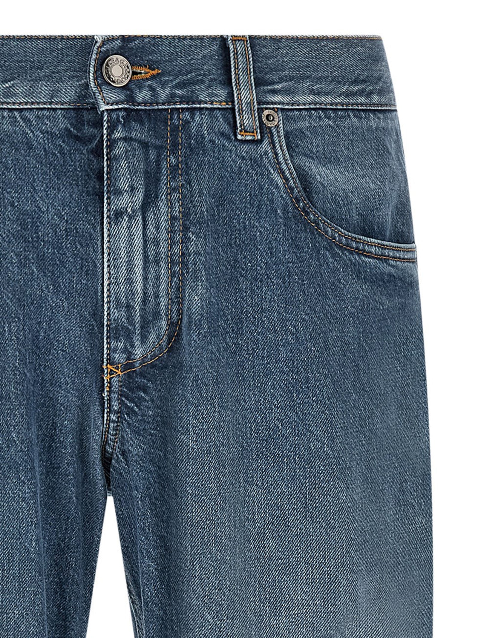Jeans droits en coton bleu Dolce & Gabbana, style classique, visible avec détail de la coupe et la texture du tissu.