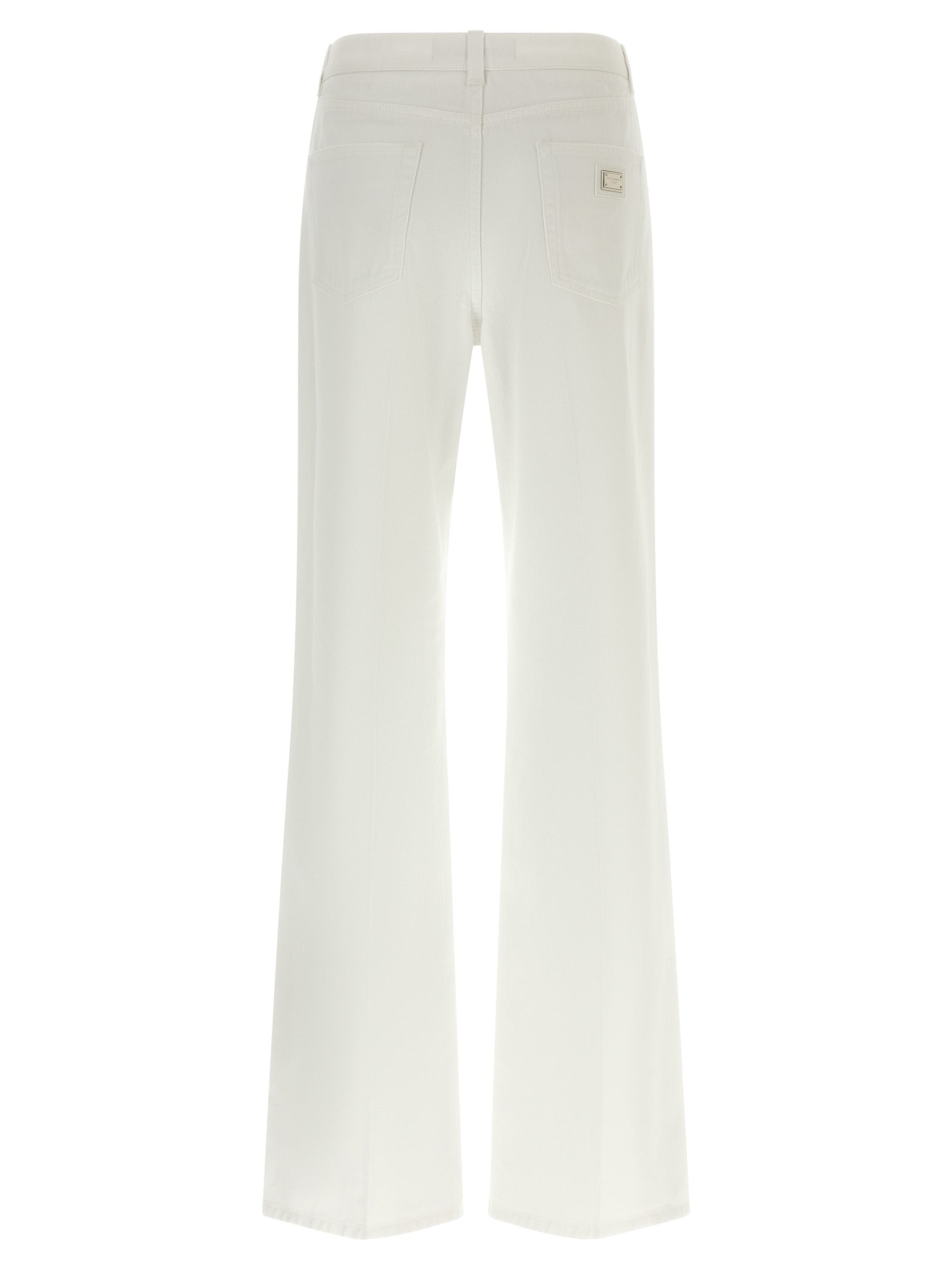 Jeans évasés en coton blanc de Dolce & Gabbana, style décontracté et tendance, montrant la coupe évasée et la texture du tissu.
