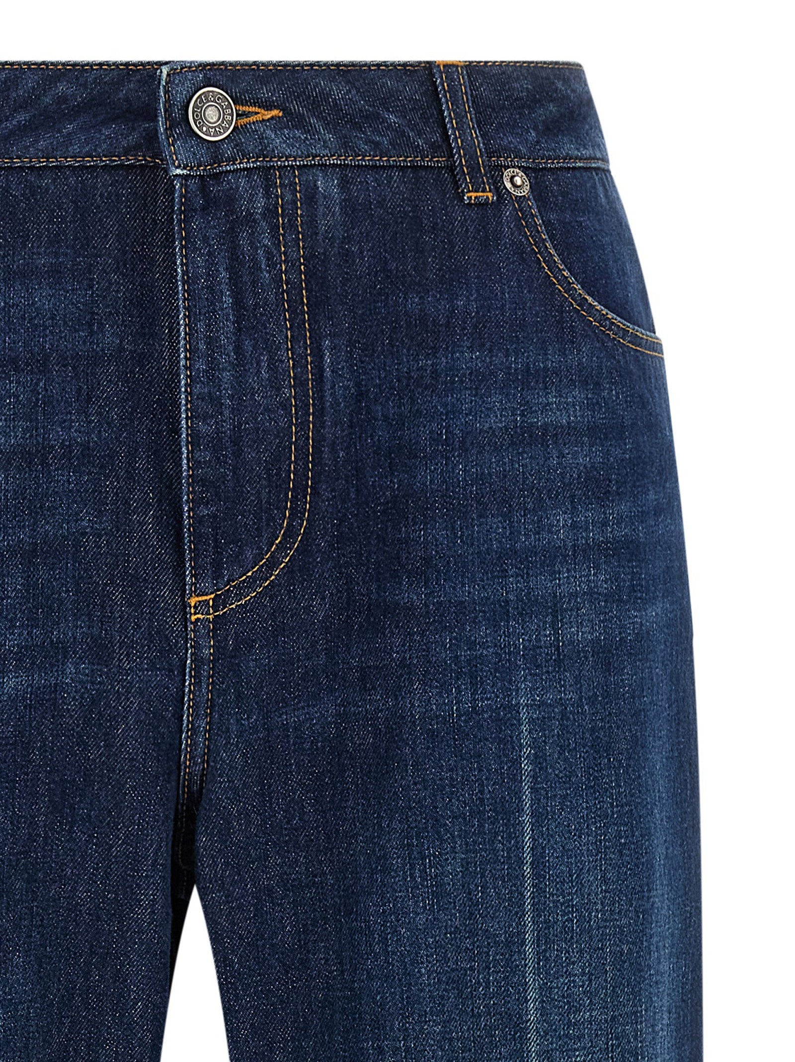 Jeans droits en coton bleu Dolce & Gabbana, style classique, visible avec détails de couture et fermeture à boutons.