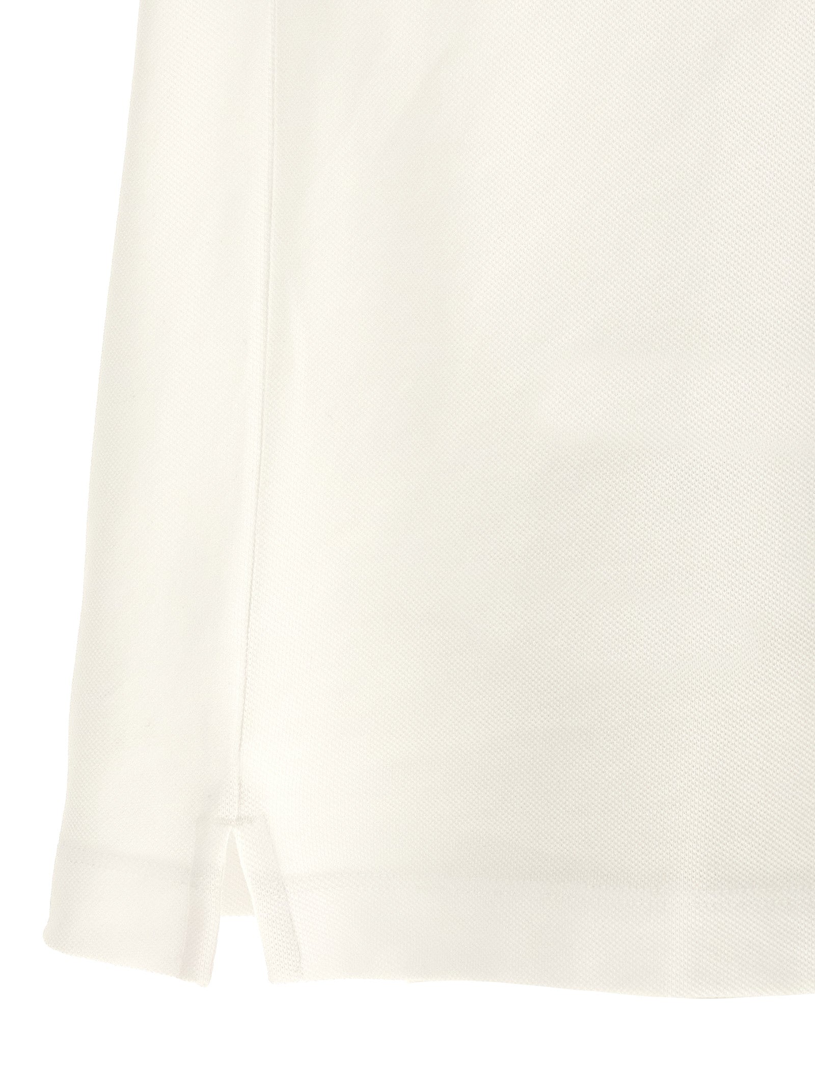 Chemise polo blanche en coton de la marque Hugo Boss, vue de face, avec col classique et logo discret.