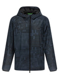 Veste en caoutchouc bleue Hugo Boss, coque légère imperméable avec capuche et fermeture éclair.