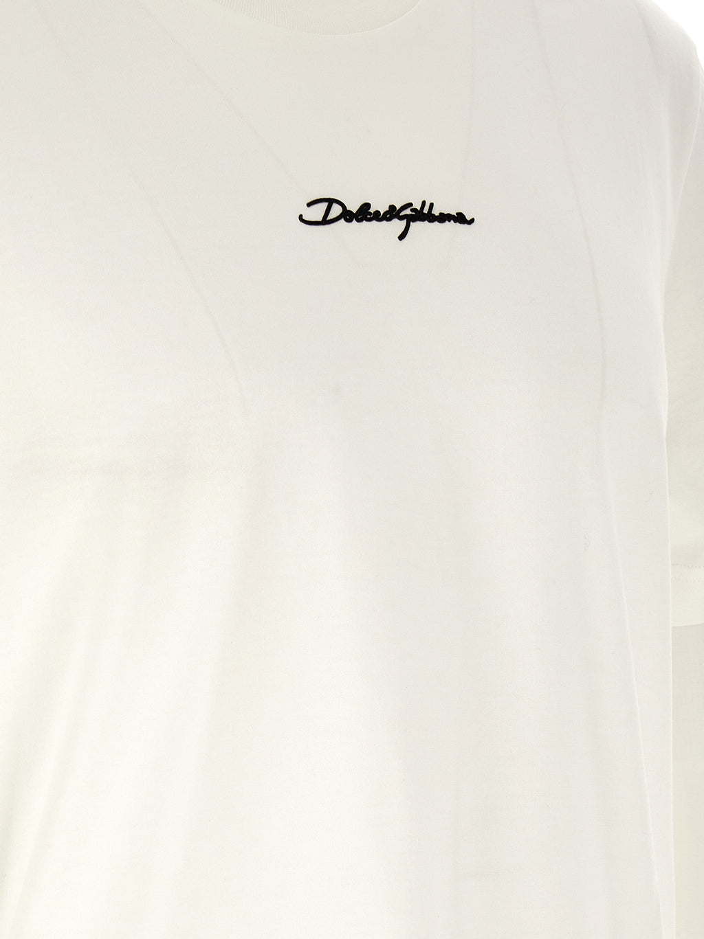 T-shirt en coton blanc de Dolce & Gabbana, coupe classique avec logo discret, portée sur un mannequin.