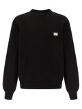 Sweat-shirt noir en coton de Dolce & Gabbana, style décontracté avec logo discret, porté sur un mannequin.