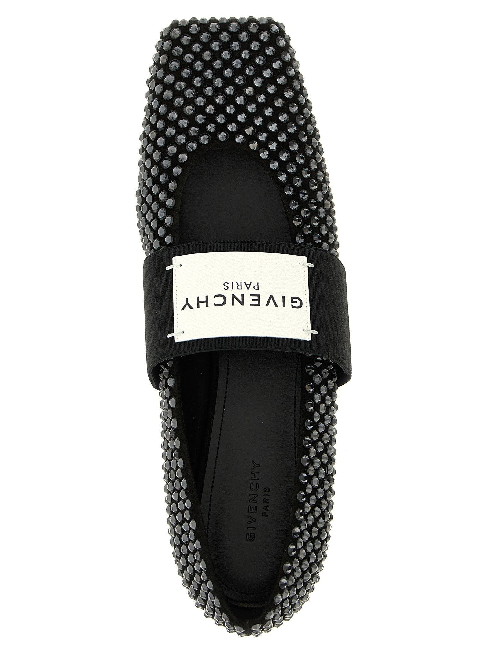 Chaussures de ballerines Givenchy en cuir de veau noir, élégantes et sophistiquées, visibles sur l'image.