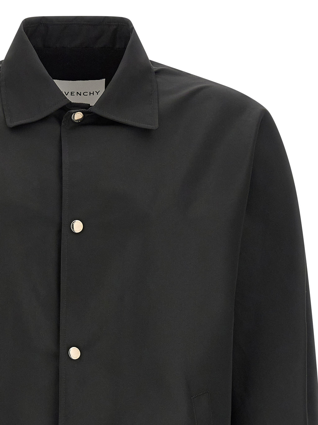 Veste en polyester noire Givenchy, style moderne et élégante, avec détails de couture visibles et coupe ajustée.