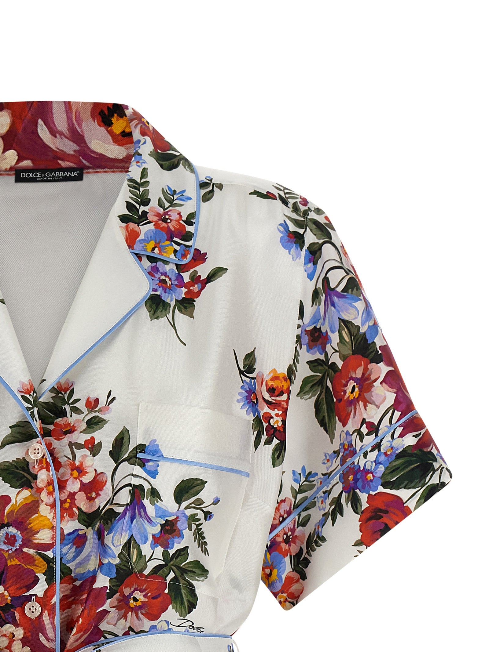 Chemise en soie blanche Dolce & Gabbana avec col et manches longues, élégante et fluide pour un look sophistiqué.