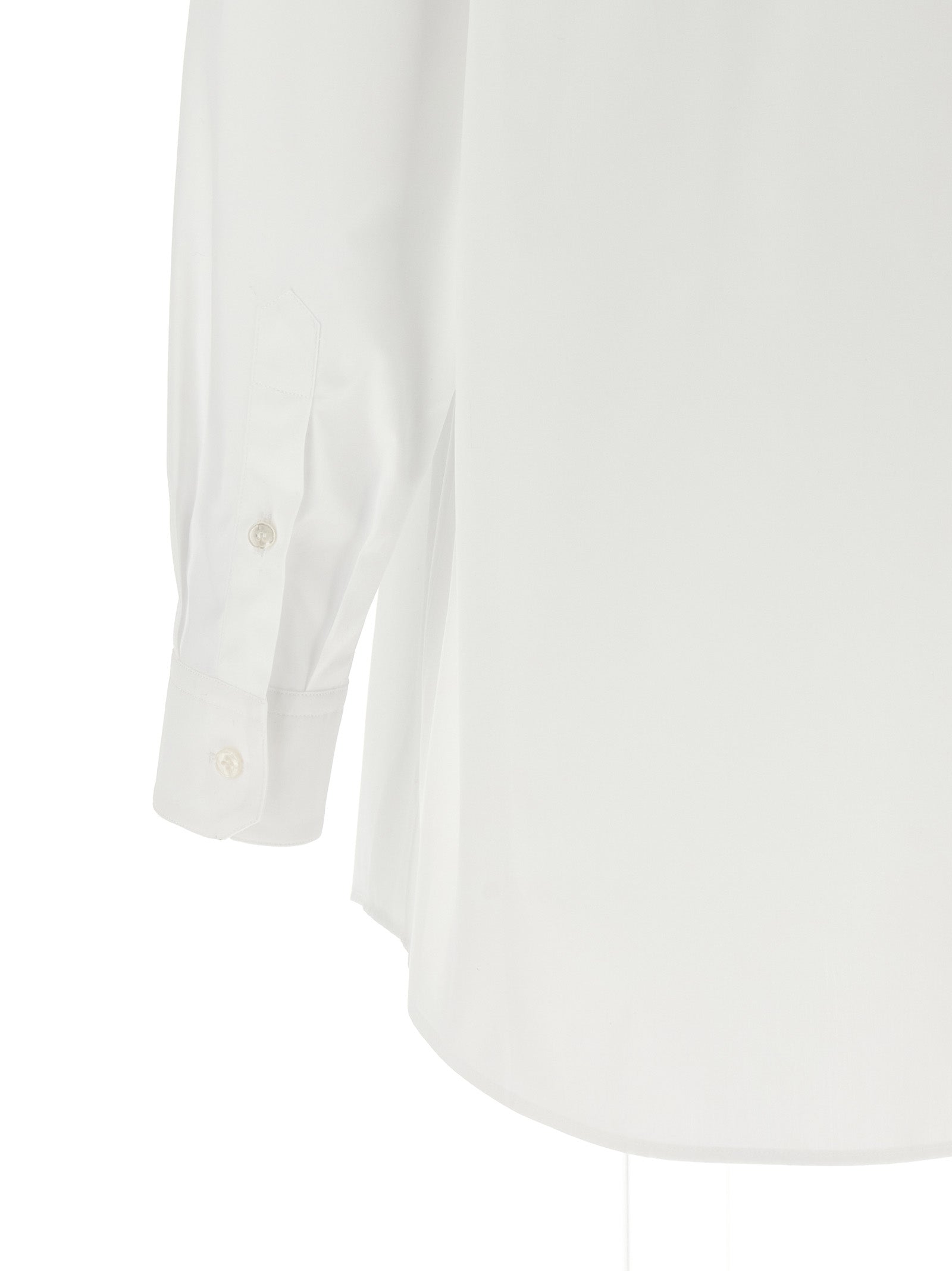 Blouse en coton blanc de Dolce & Gabbana, style élégant avec détails sophistiqués, portée sur mannequin.