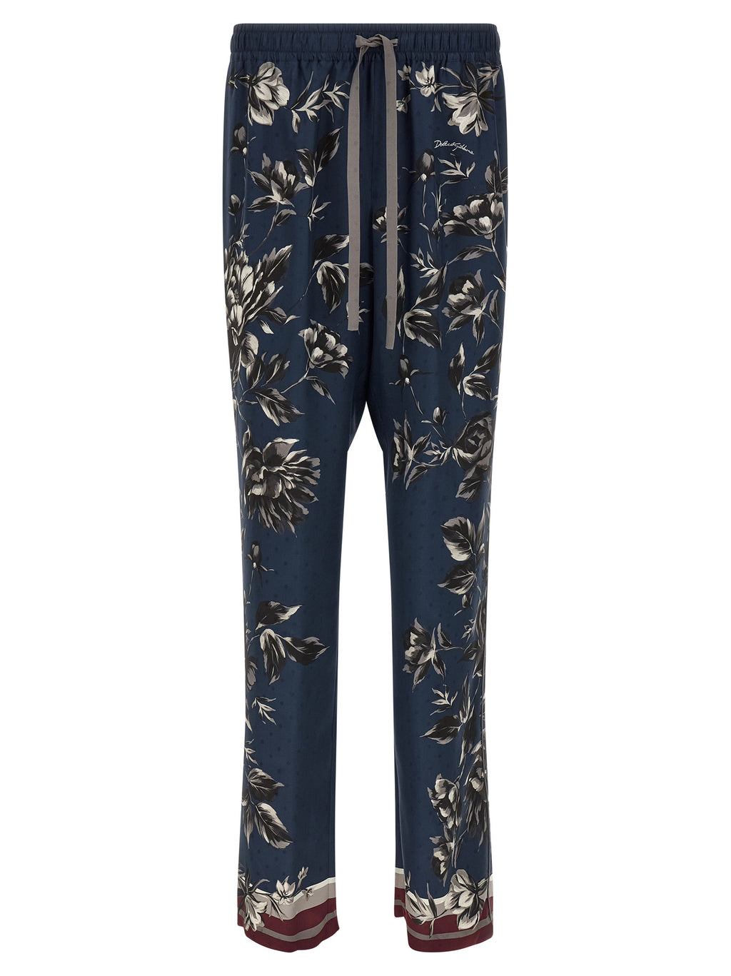 Pantalon décontracté en soie bleue de Dolce & Gabbana, style élégant et confortable, vue de face avec détails de la matière.