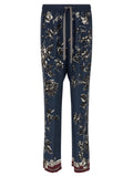 Pantalon décontracté en soie bleue de Dolce & Gabbana, style élégant et confortable, vue de face avec détails de la matière.