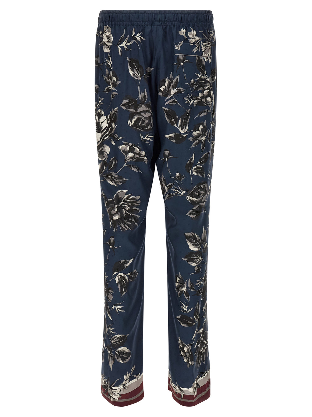 Pantalons décontractés en soie bleue de Dolce & Gabbana, coupe élégante et tissu léger visible sur cette image.