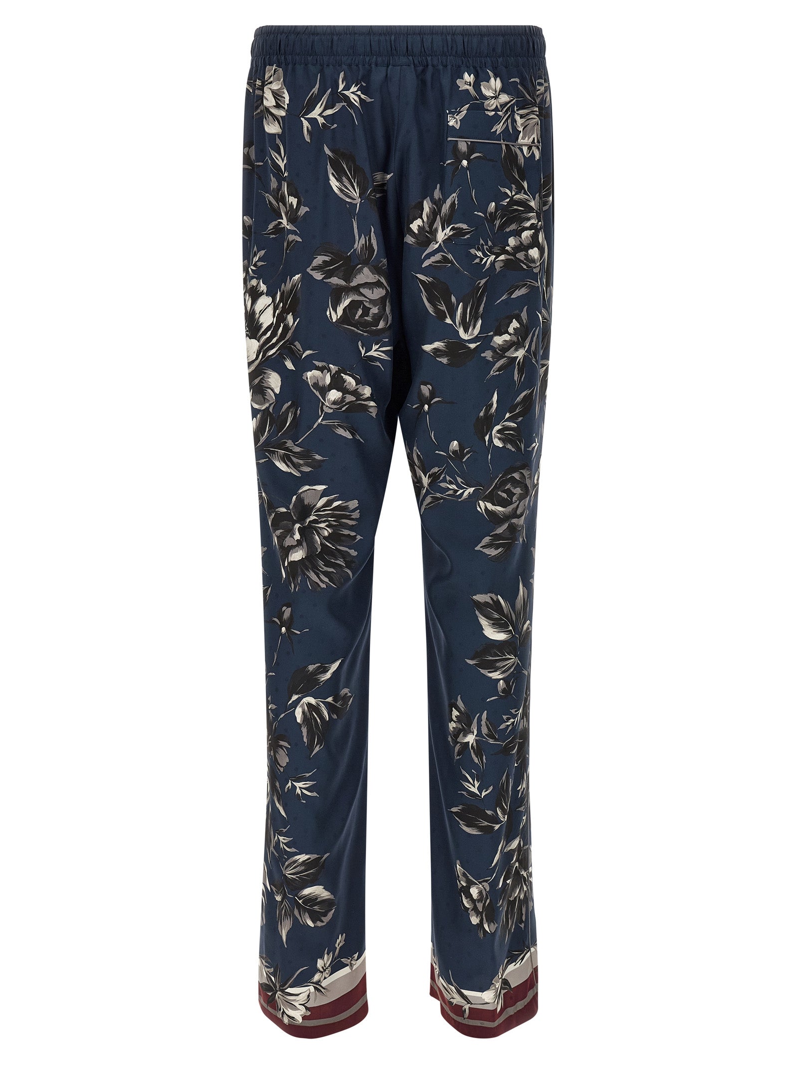 Pantalons décontractés en soie bleue de Dolce & Gabbana, coupe élégante et tissu léger visible sur cette image.