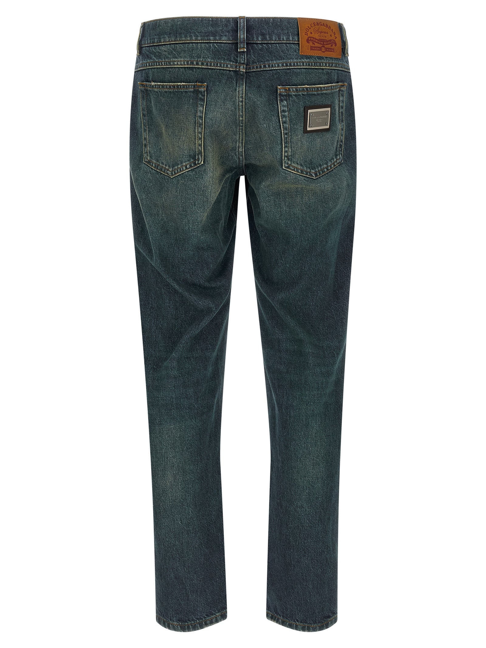 Jeans droits en coton bleu Dolce & Gabbana, coupe classique, visibles sur une mannequin avec détails de couture.