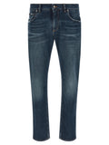 Jeans en denim bleu Dolce & Gabbana en coton, coupe classique avec détails en denim visible sur l'image.