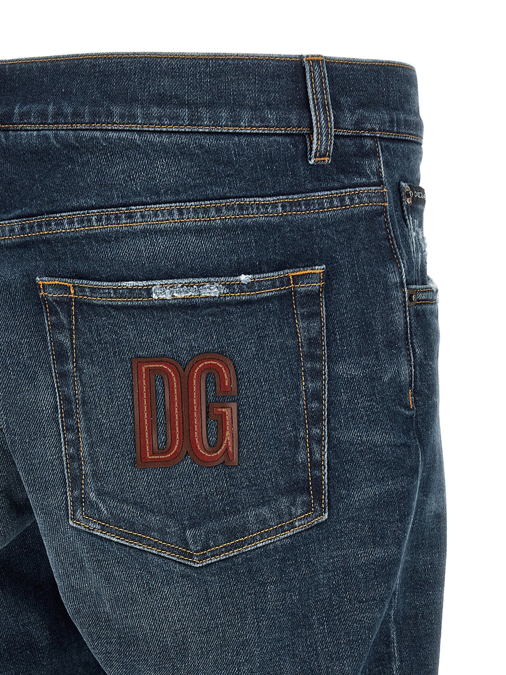 Jeans en denim coton bleu de Dolce & Gabbana, coupe classique, visibles détails de couture et bouton en métal.