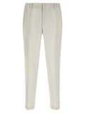 Pantalon beige en laine vierge de Dolce & Gabbana, style élégant et classique pour femme, visible en détail.