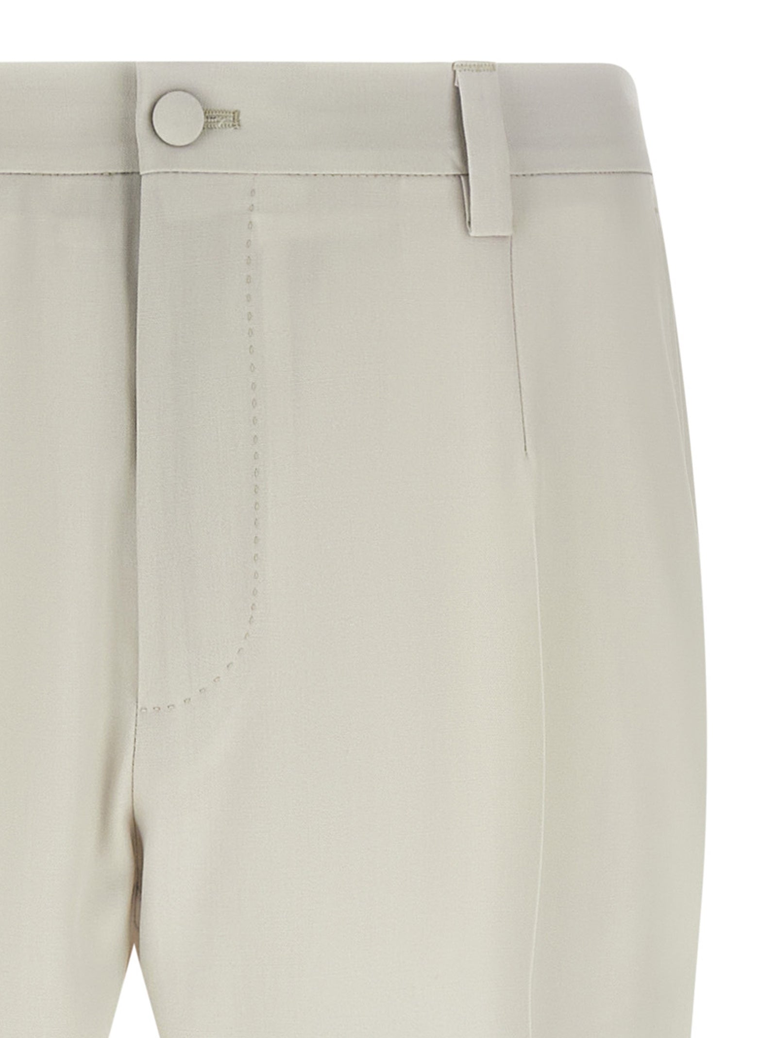 Pantalon beige en laine vierge de Dolce & Gabbana, pantalon élégant pour femme avec coupe classique et finition soignée.