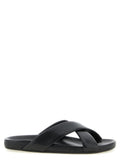 Sandales Saint Laurent en cuir d'agneau noir, élégantes et modernes, avec design épuré et finition de haute qualité.