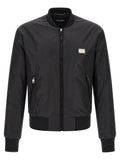 Veste bomber noire en polyamide de Dolce & Gabbana, style élégant avec détails modernes, vue de face sur une image claire.