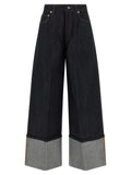 Jean évasé en coton bleu Givenchy, coupe fluide et tendance, détails modernes pour un style chic et décontracté.
