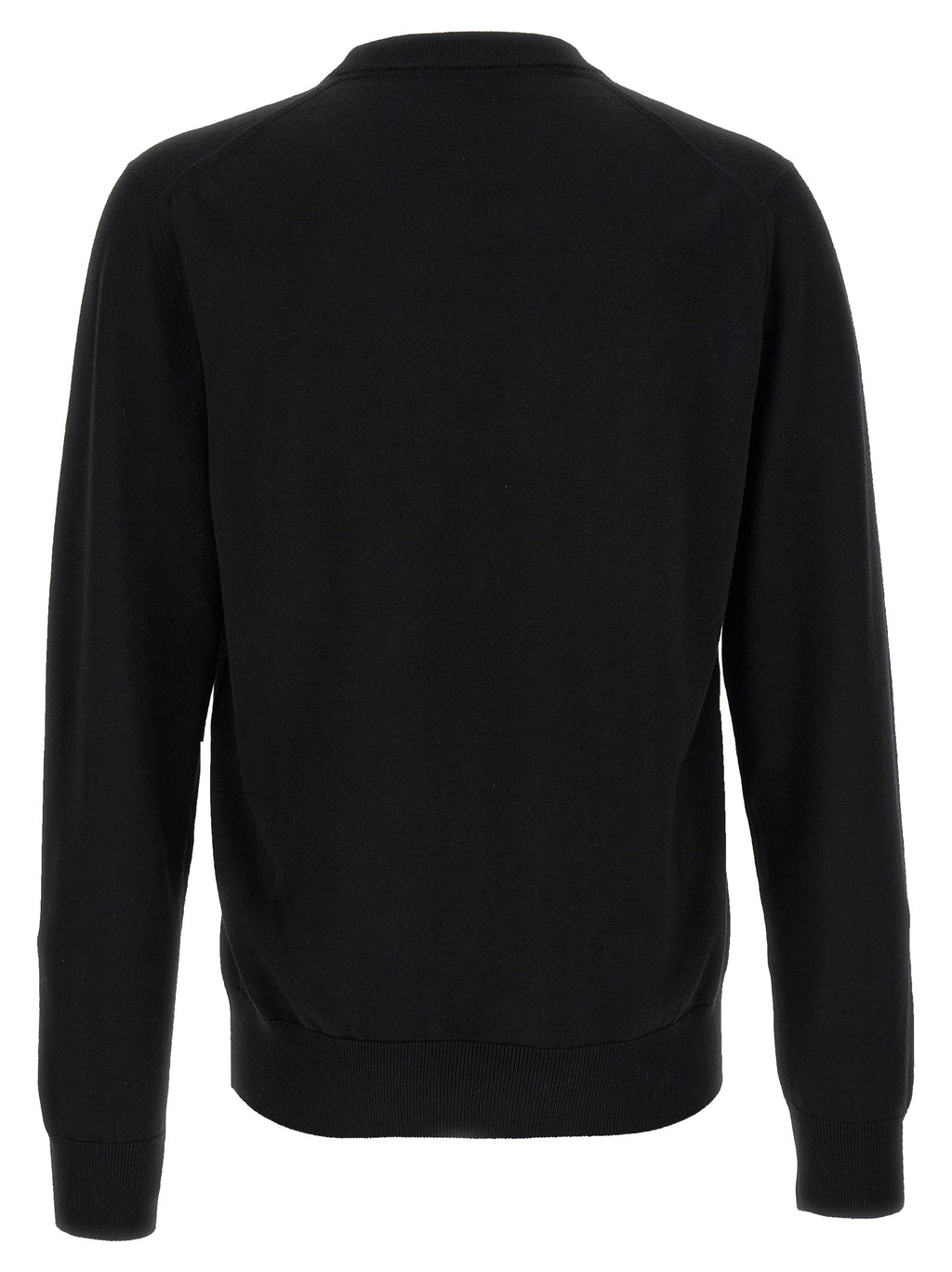 Cardigan noir en laine vierge de Dolce & Gabbana, modèle élégamment porté, avec détails de finition soignés.