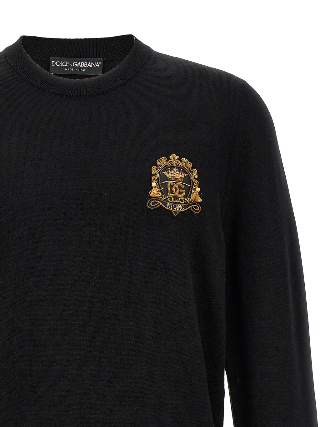 Cardigan en laine vierge noire de Dolce & Gabbana, coupe élégante et détails sophistiqués, porté ou posé sur un fond neutre.